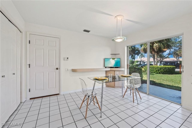 dining space with light tile patterned flooring