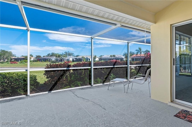 view of patio / terrace with a lanai