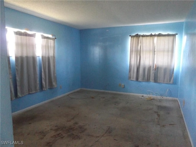 14 Richmond Ave N, Lehigh Acres, FL 33936 - empty room featuring a healthy amount of sunlight