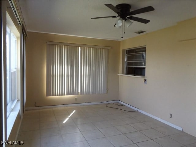 14 Richmond Ave N, Lehigh Acres, FL 33936 - tiled spare room featuring ceiling fan