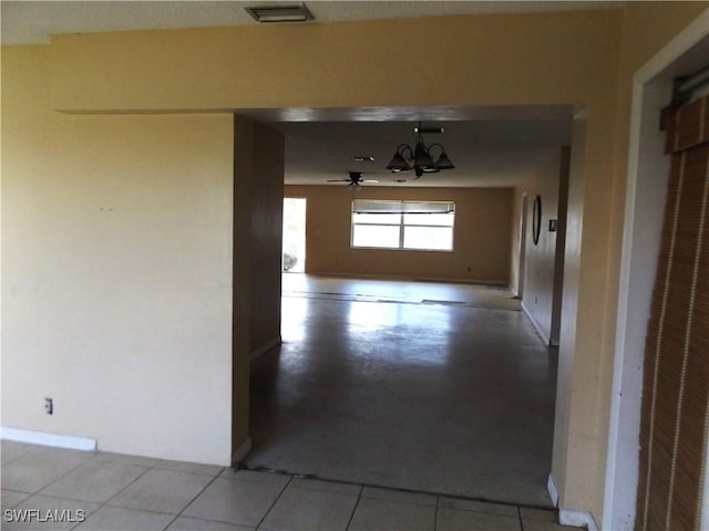 14 Richmond Ave N, Lehigh Acres, FL 33936 - corridor featuring light tile patterned flooring and a notable chandelier