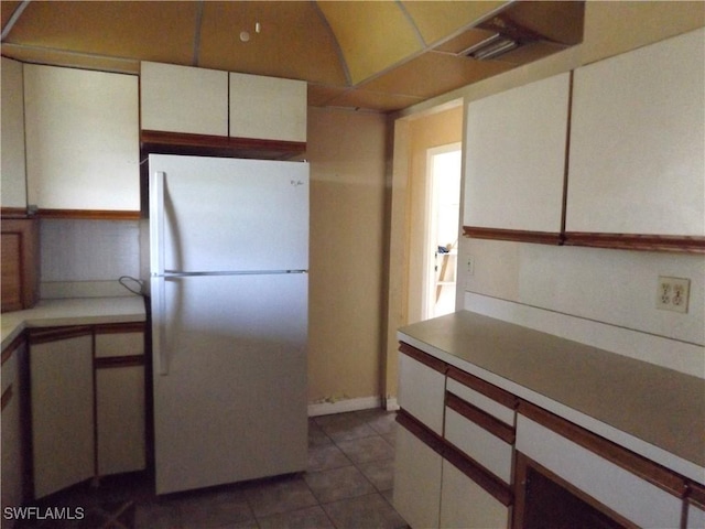 14 Richmond Ave N, Lehigh Acres, FL 33936 - kitchen featuring white refrigerator and dark tile patterned floors