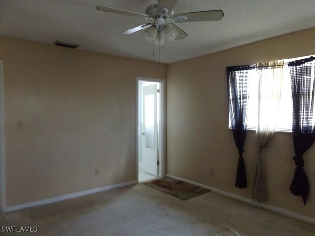 14 Richmond Ave N, Lehigh Acres, FL 33936 - spare room featuring ceiling fan