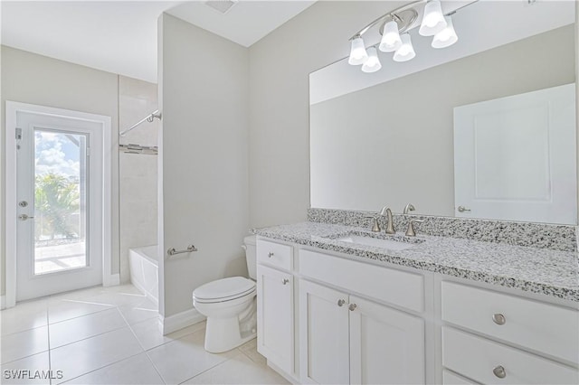 full bathroom featuring tile patterned flooring, vanity, tiled shower / bath, and toilet