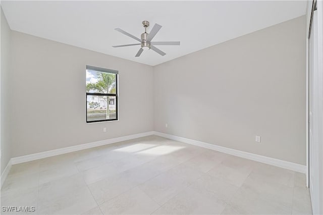 spare room with ceiling fan