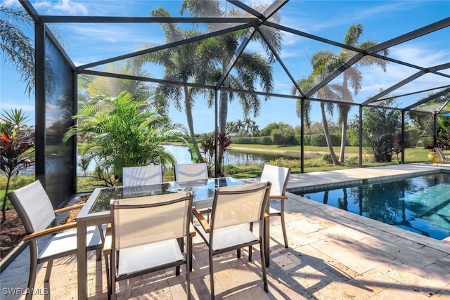 view of patio / terrace with a water view and glass enclosure