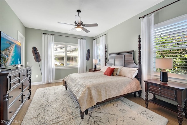 bedroom with hardwood / wood-style flooring and ceiling fan