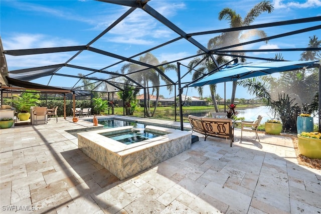 view of patio with an in ground hot tub, a water view, and glass enclosure