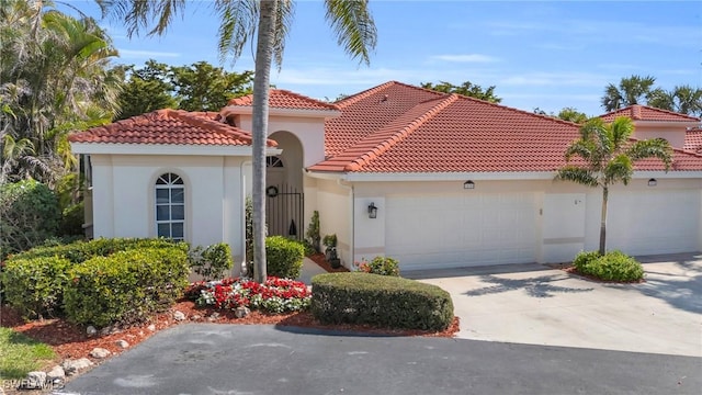 mediterranean / spanish-style house featuring a garage