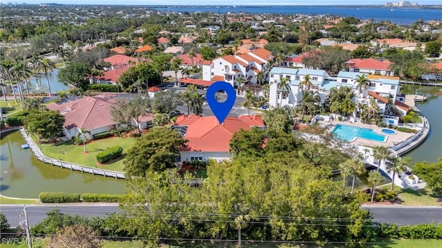 birds eye view of property with a water view