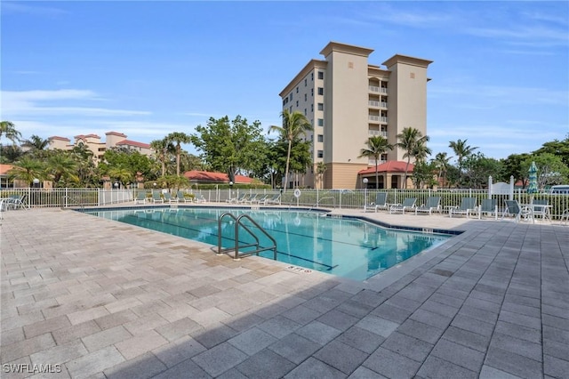 view of swimming pool with a patio area