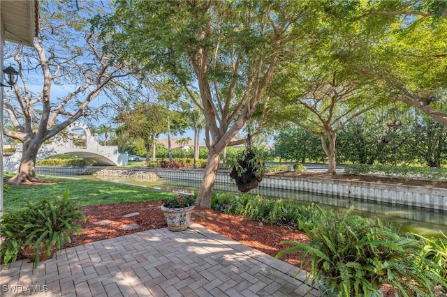 view of patio featuring a water view