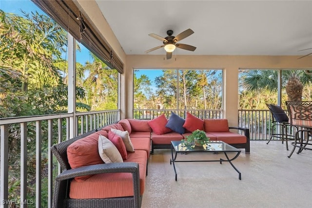 sunroom featuring ceiling fan