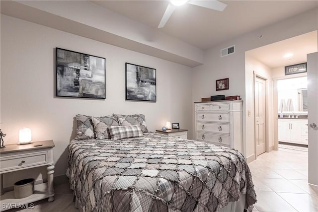 bedroom featuring ceiling fan, connected bathroom, and light tile patterned floors