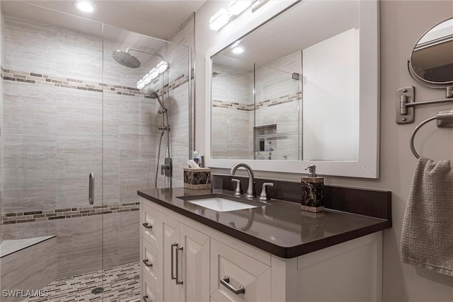 bathroom featuring vanity and walk in shower