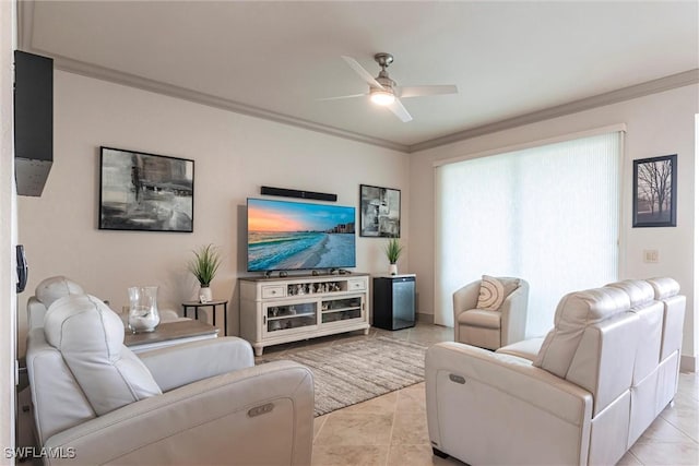 tiled living room featuring ornamental molding and ceiling fan