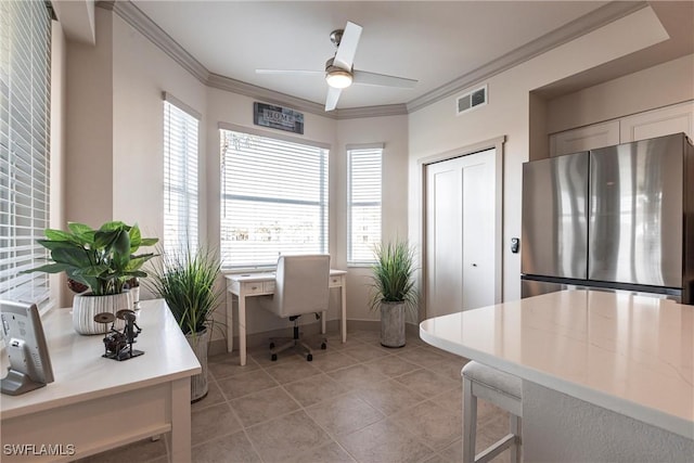 office space with ornamental molding, a wealth of natural light, ceiling fan, and light tile patterned floors