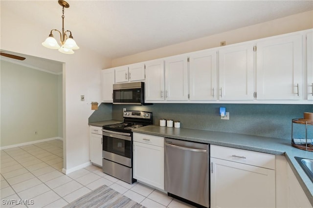 kitchen featuring an inviting chandelier, light tile patterned floors, appliances with stainless steel finishes, pendant lighting, and white cabinets