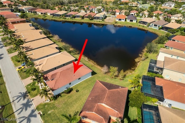 birds eye view of property with a water view