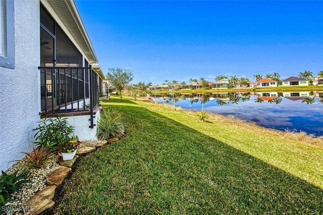 view of yard with a water view