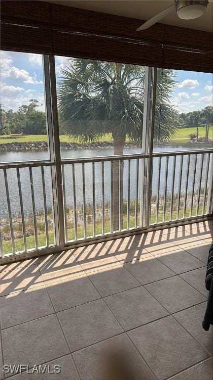 unfurnished sunroom with a water view