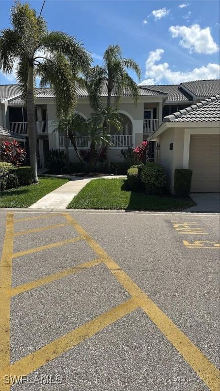 view of car parking featuring a garage