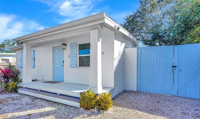 3100 Connecticut Ave, Naples, FL 34112 - entrance to property with stucco siding and a gate