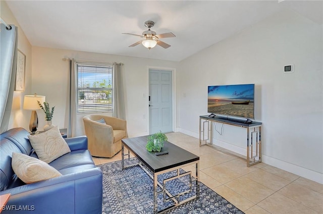 living room featuring light tile patterned flooring, ceiling fan, and baseboards