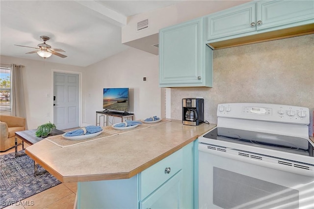 kitchen with visible vents, a peninsula, blue cabinetry, and white electric range oven