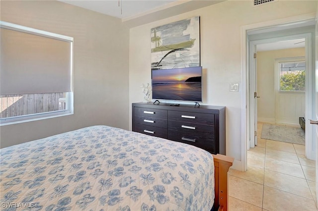 bedroom featuring light tile patterned flooring and visible vents