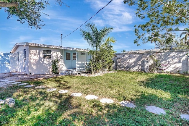 exterior space with french doors and fence