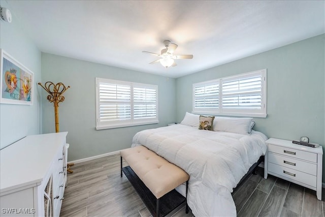 bedroom featuring ceiling fan and light hardwood / wood-style floors