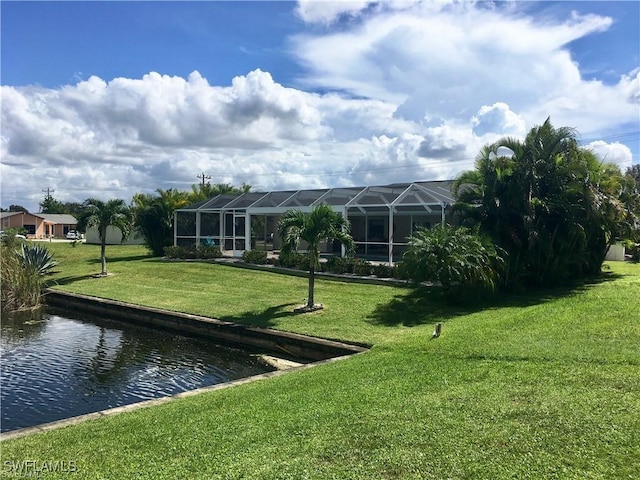 view of community featuring a water view and a lawn