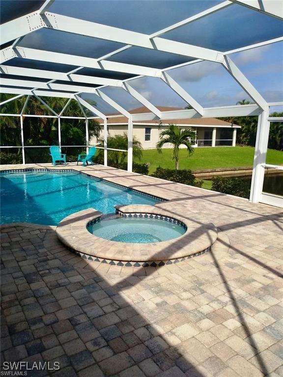 view of pool with an in ground hot tub, a lanai, and a patio area