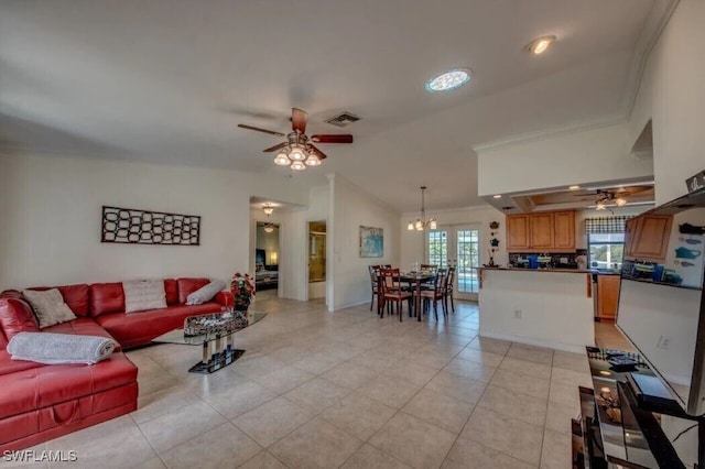 tiled living room featuring ornamental molding, lofted ceiling, and ceiling fan