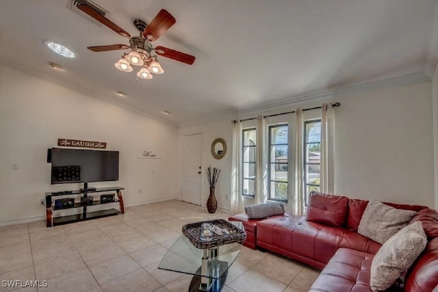 tiled living room with ornamental molding and ceiling fan