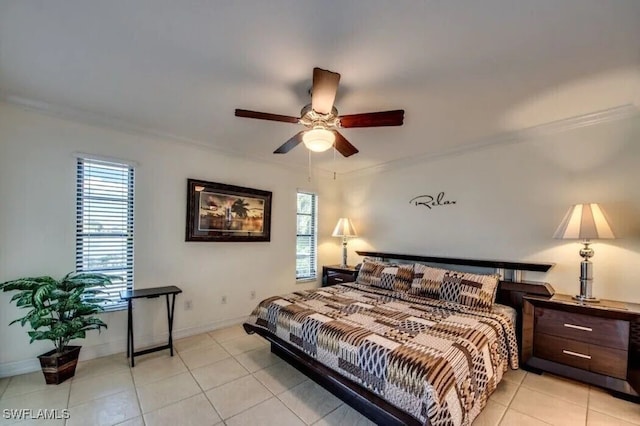 tiled bedroom with crown molding, ceiling fan, and multiple windows