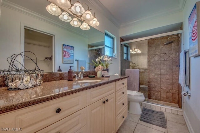 bathroom featuring vanity, a shower with shower door, ornamental molding, and toilet