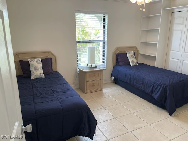 bedroom with light tile patterned flooring