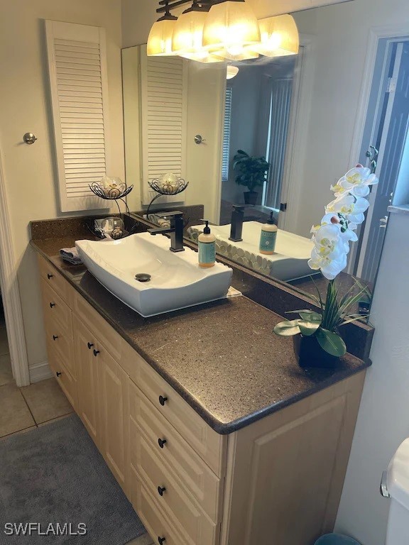 bathroom with vanity and tile patterned flooring