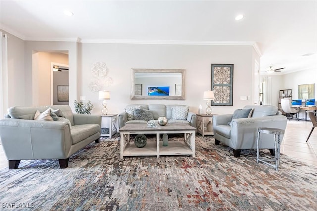 living room with crown molding and ceiling fan