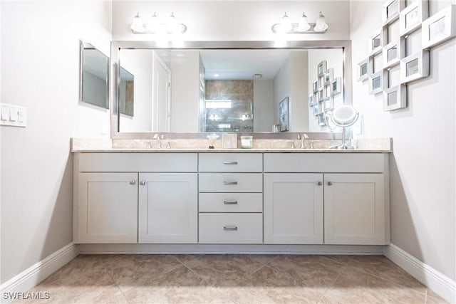 bathroom featuring vanity and tiled shower