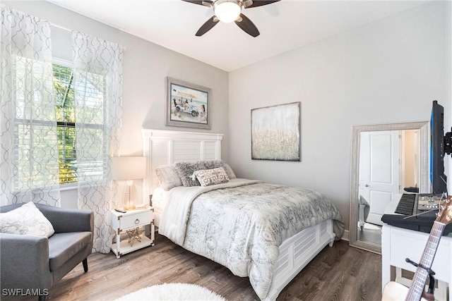 bedroom featuring wood-type flooring and ceiling fan