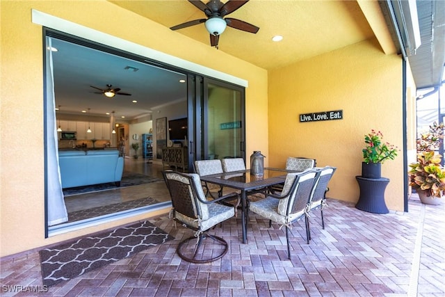 view of patio / terrace featuring ceiling fan