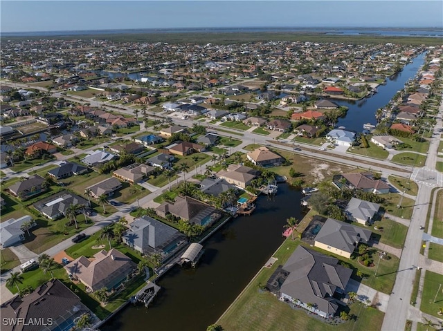 bird's eye view with a residential view and a water view