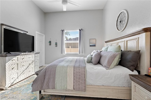 bedroom with baseboards and a ceiling fan