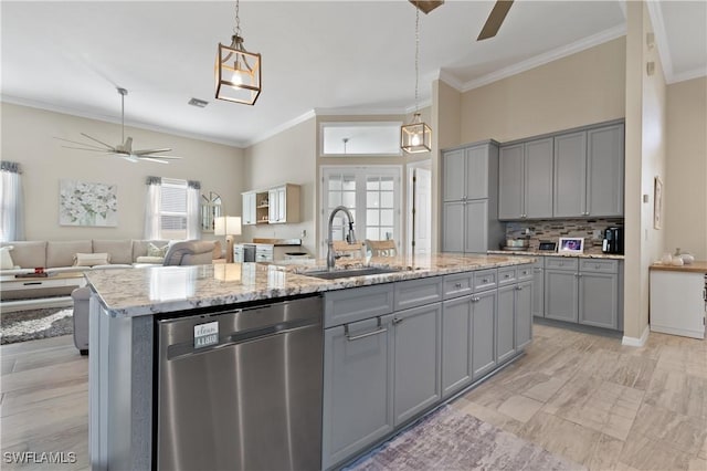 kitchen with a sink, a ceiling fan, dishwasher, and gray cabinetry