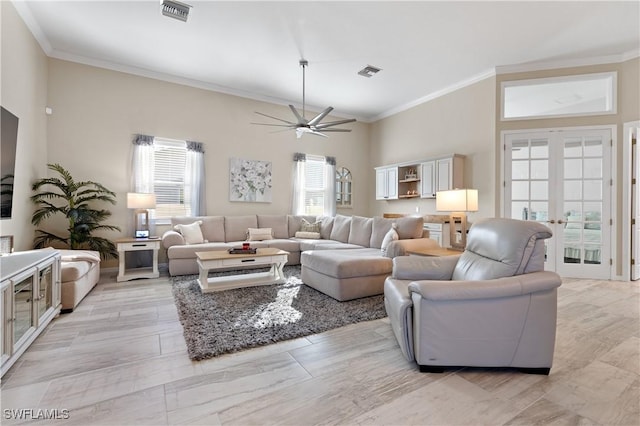 living area featuring visible vents, crown molding, and french doors