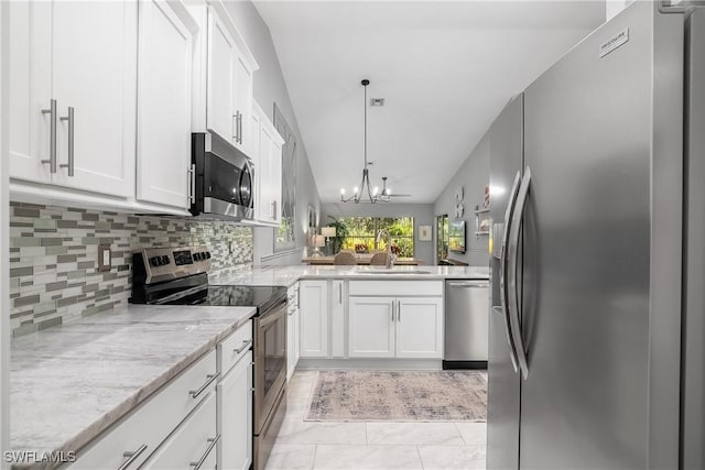 kitchen featuring sink, white cabinetry, stainless steel appliances, tasteful backsplash, and light stone countertops