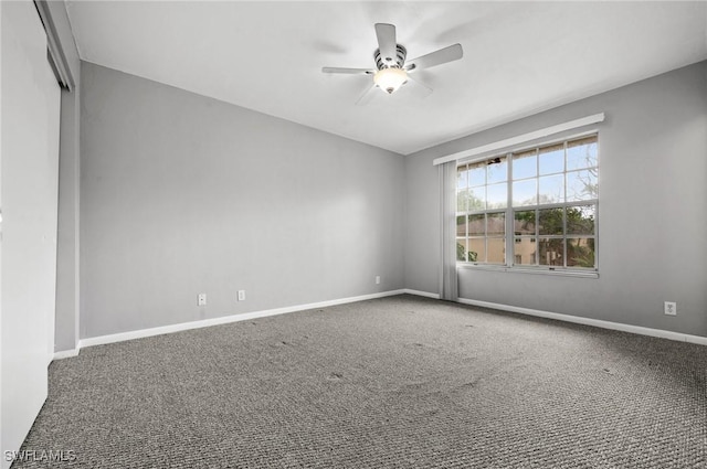 unfurnished room featuring ceiling fan, carpet flooring, and baseboards